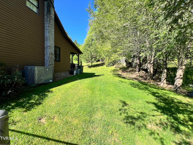 view of yard featuring central air condition unit