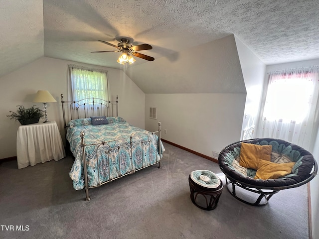 bedroom featuring lofted ceiling, carpet floors, ceiling fan, and multiple windows