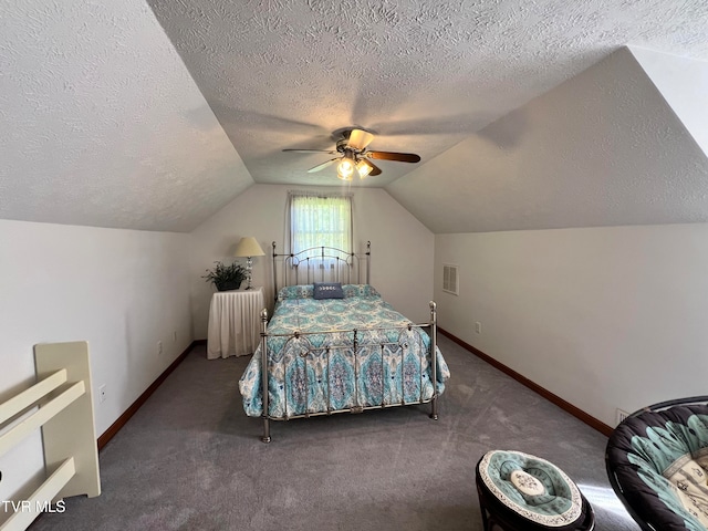 carpeted bedroom with vaulted ceiling, ceiling fan, and a textured ceiling