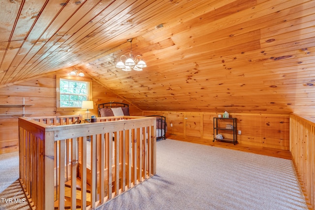 additional living space with a notable chandelier, light carpet, lofted ceiling, and wooden ceiling