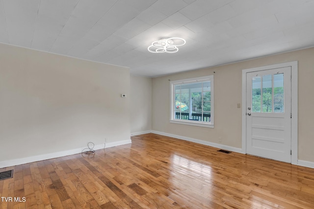 empty room with light wood-type flooring