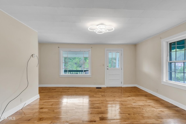 spare room with light wood-type flooring