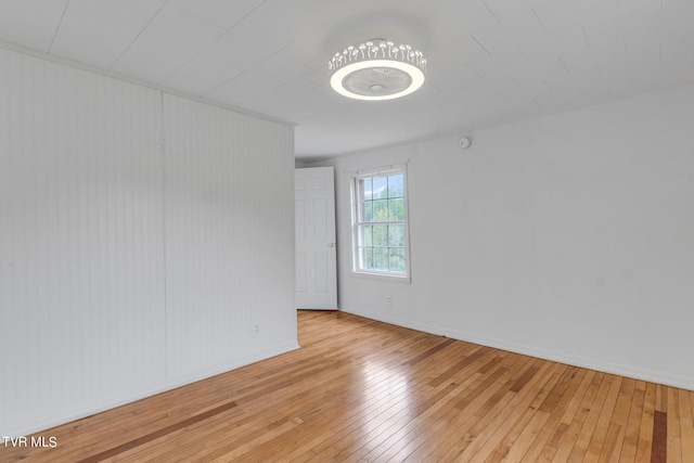 empty room with light hardwood / wood-style flooring