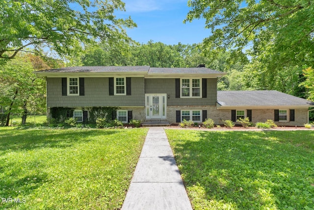 raised ranch featuring a front yard