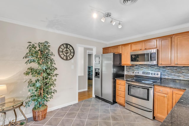 kitchen featuring crown molding, tile flooring, tasteful backsplash, and stainless steel appliances