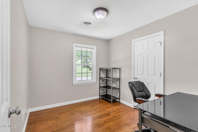 office area with hardwood / wood-style flooring