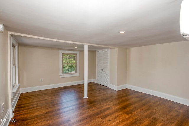 basement with dark wood-type flooring