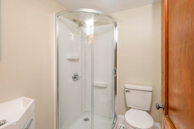 bathroom with walk in shower and toilet