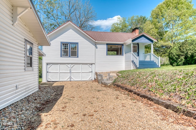 view of front of property with a garage and a porch