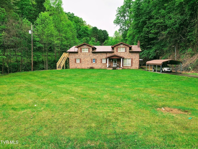 view of front facade featuring a carport and a front yard