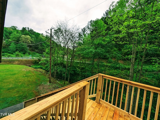 wooden deck with a yard