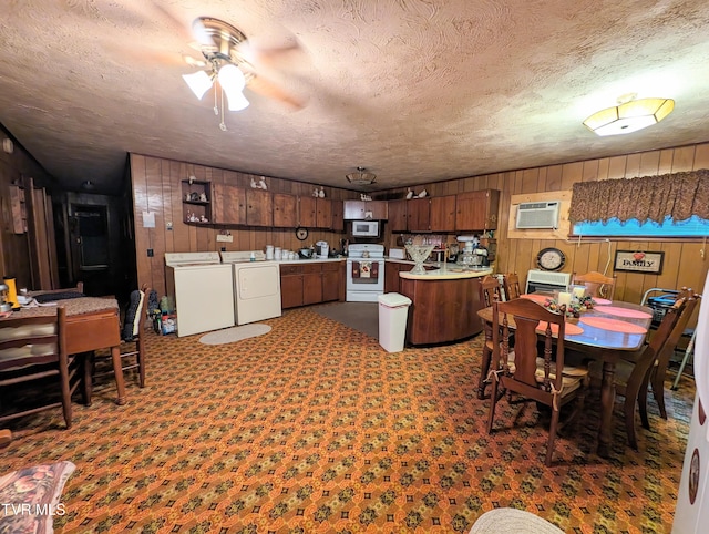 dining space featuring carpet, a wall mounted AC, a textured ceiling, and ceiling fan