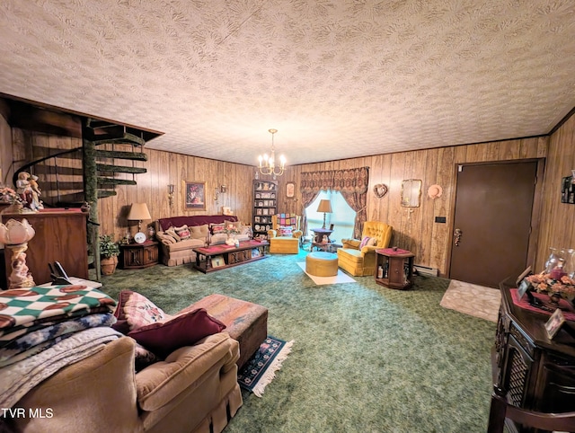 living room featuring carpet flooring, a notable chandelier, wooden walls, and a textured ceiling