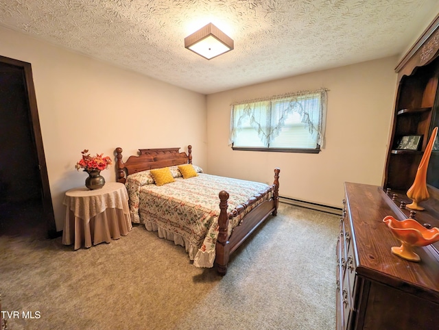 bedroom with carpet floors, a textured ceiling, and baseboard heating