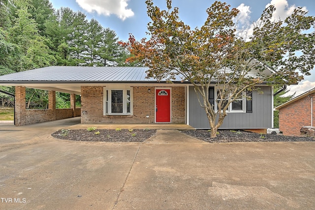 view of front of home with a carport