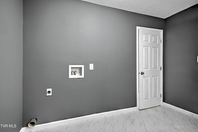 clothes washing area with electric dryer hookup, a textured ceiling, and hookup for a washing machine