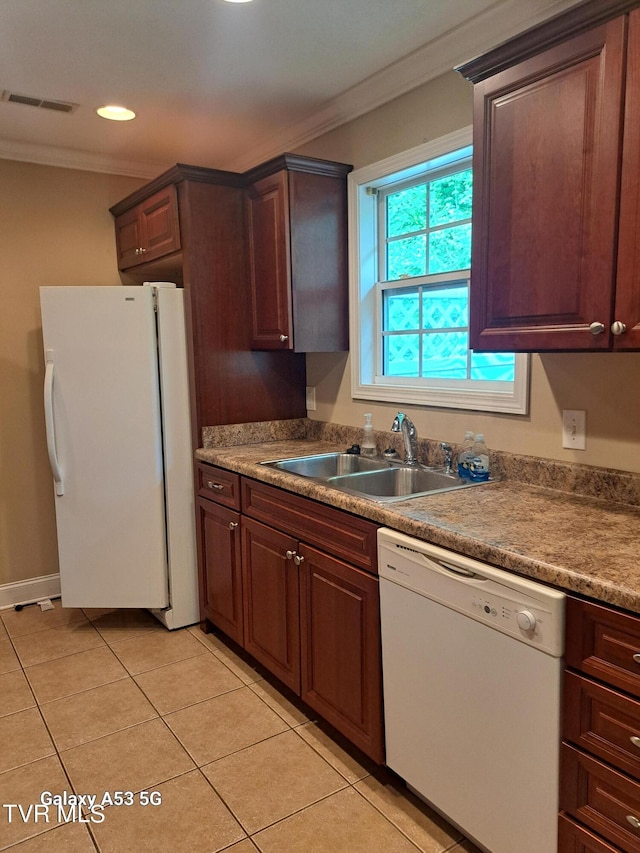 kitchen featuring ornamental molding, white appliances, dark brown cabinetry, sink, and light tile floors