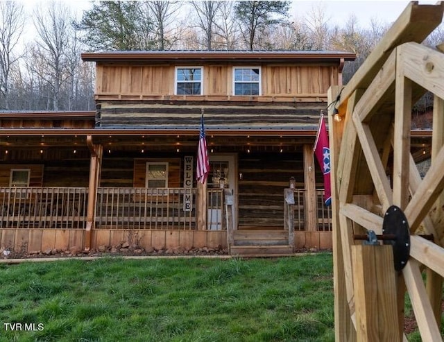 exterior space with a front lawn and a porch