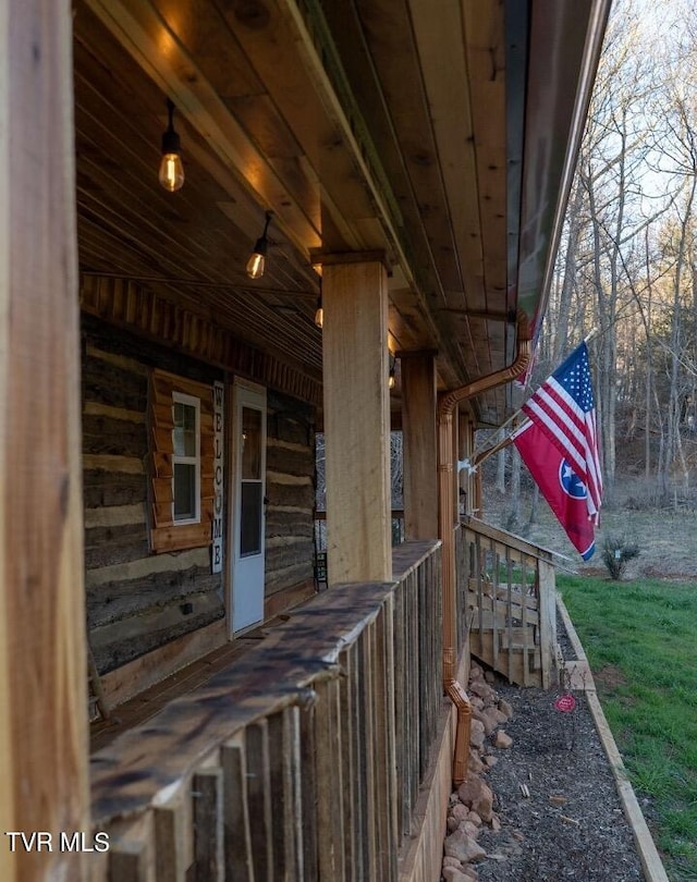 view of property exterior with a porch