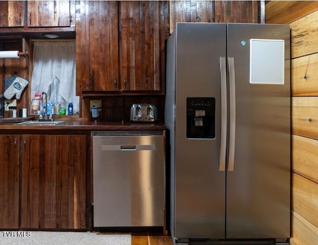 kitchen featuring appliances with stainless steel finishes and sink