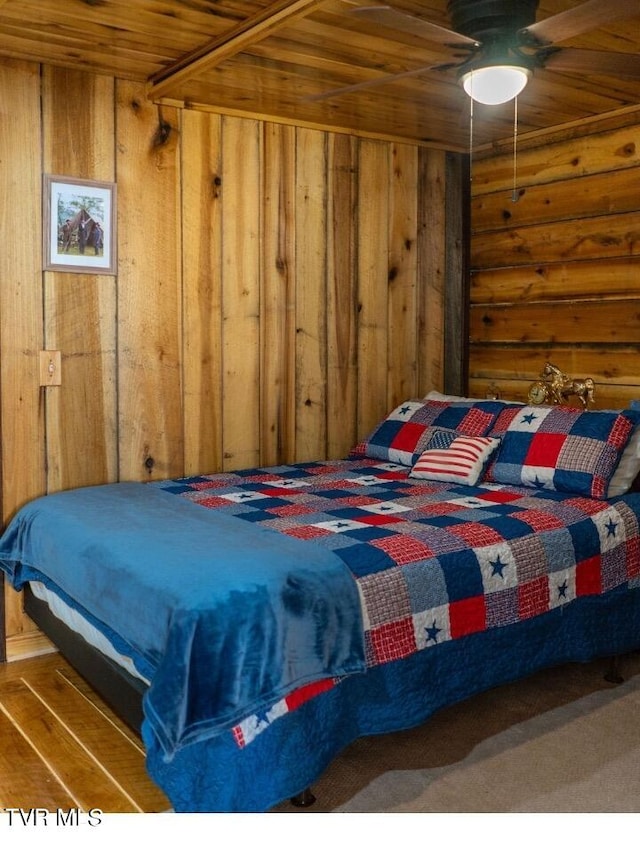 bedroom with wood ceiling and ceiling fan