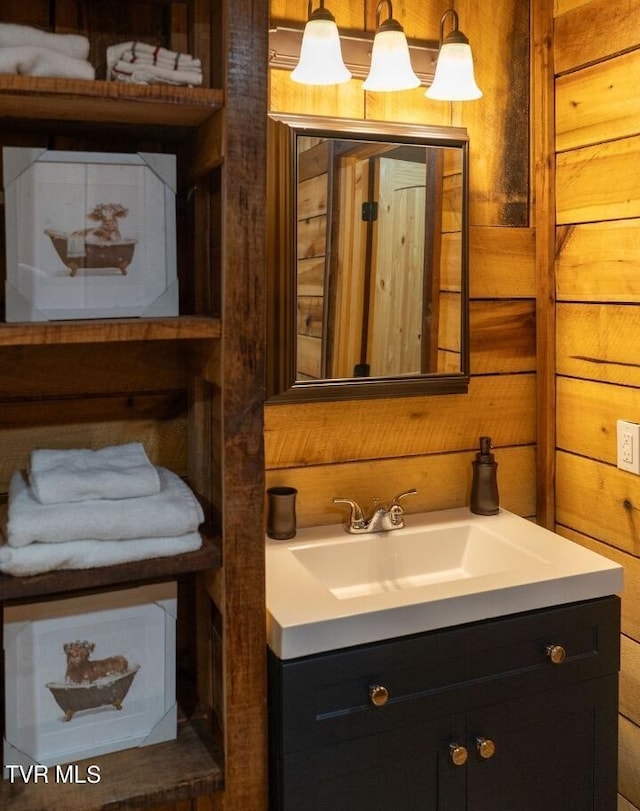 bathroom with wooden walls and vanity