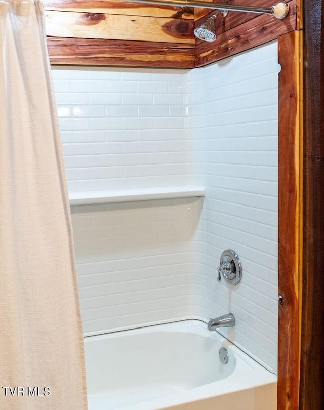 bathroom featuring shower / bath combination with curtain