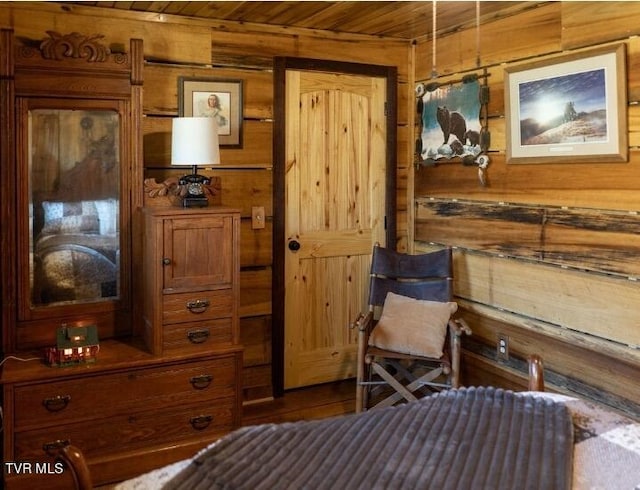 bedroom with wood-type flooring, wood walls, and wooden ceiling