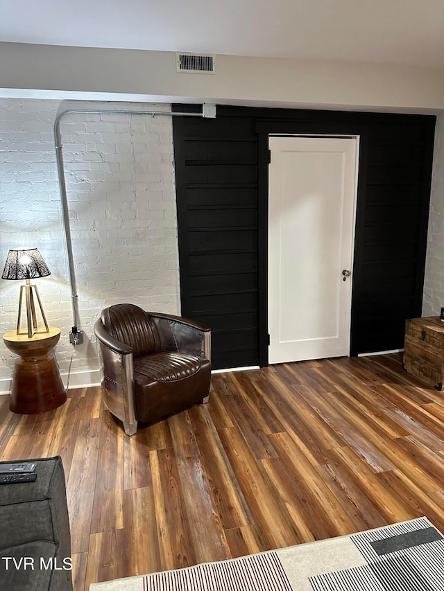 living area with hardwood / wood-style flooring