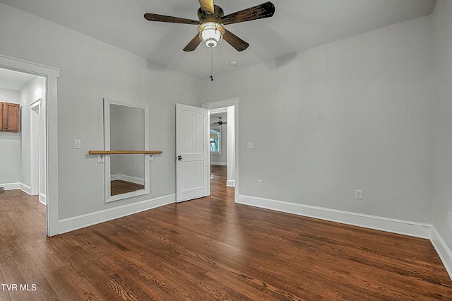 empty room with hardwood / wood-style flooring and ceiling fan