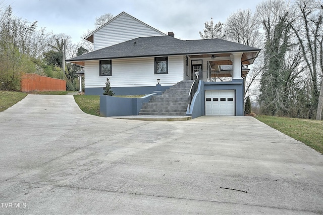 view of front of home featuring a porch and a garage