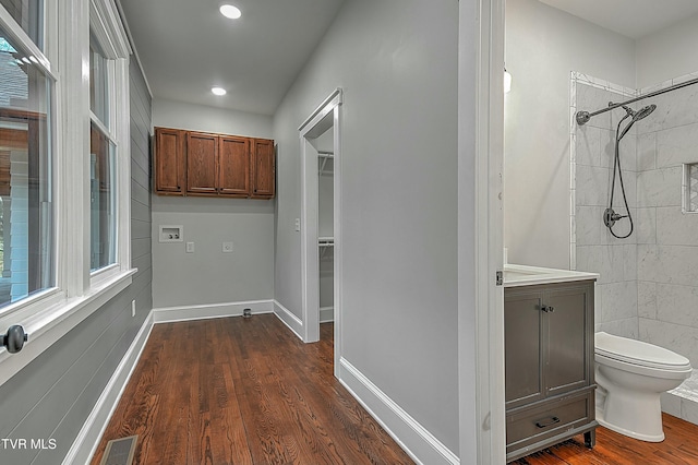 corridor with dark hardwood / wood-style floors