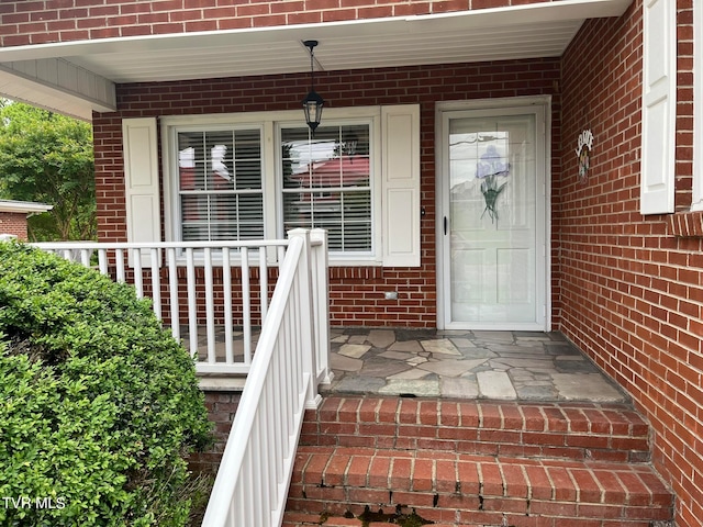 property entrance featuring covered porch