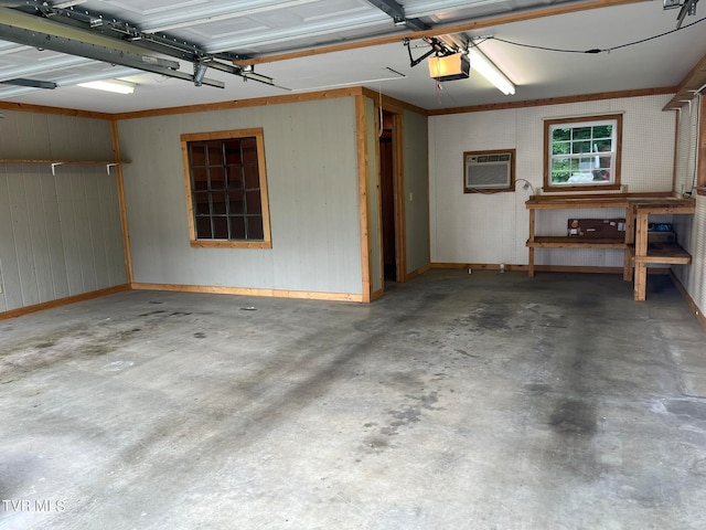 garage featuring a wall mounted AC and a garage door opener