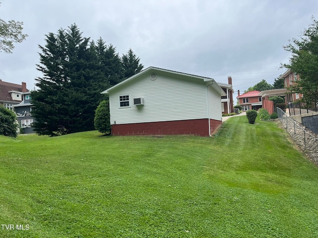 view of home's exterior with a lawn and a wall mounted air conditioner