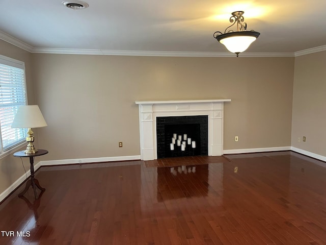 unfurnished living room featuring dark hardwood / wood-style floors and crown molding