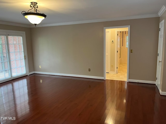 spare room featuring ornamental molding and wood-type flooring