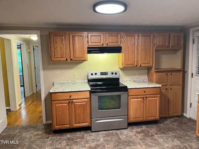 kitchen featuring dark tile flooring and stainless steel electric range oven