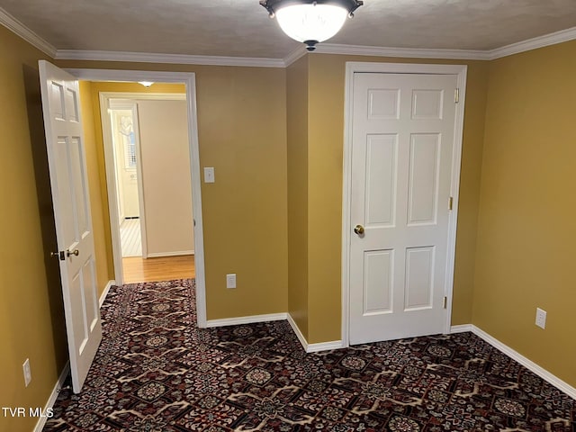 unfurnished bedroom featuring crown molding and hardwood / wood-style floors