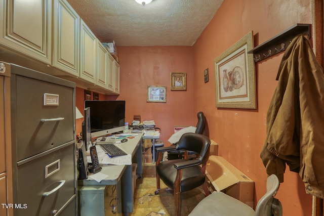 home office featuring a textured ceiling and light tile floors