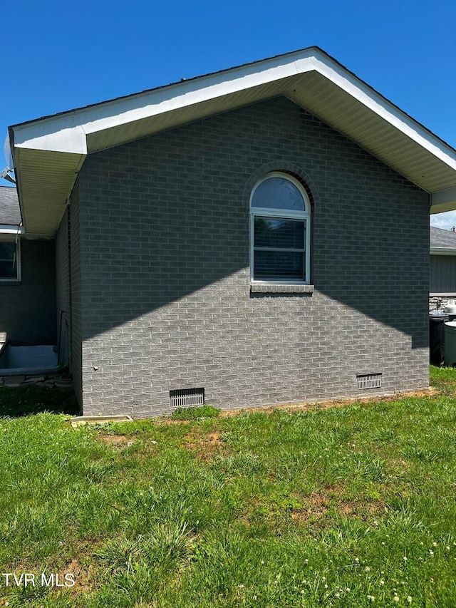 view of property exterior featuring a yard