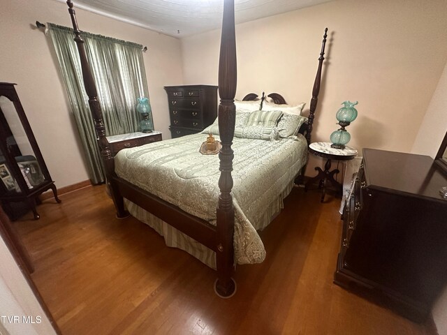 bedroom featuring dark hardwood / wood-style floors