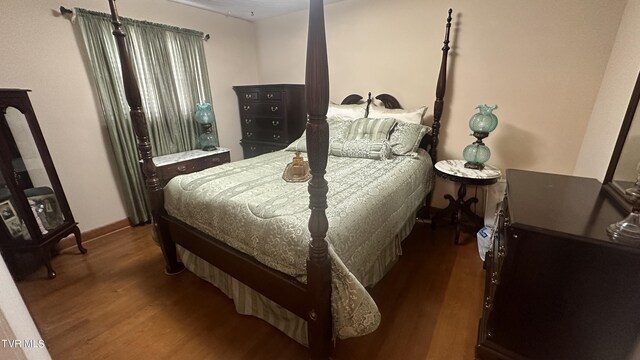 bedroom featuring dark hardwood / wood-style floors