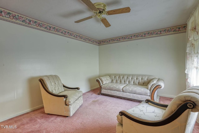 carpeted living room featuring ceiling fan