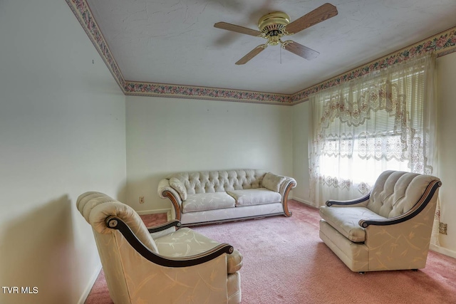 living room featuring carpet and ceiling fan