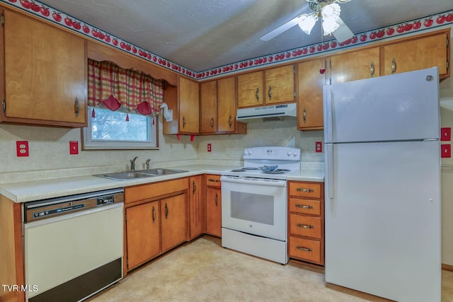 kitchen featuring white appliances, ceiling fan, and sink