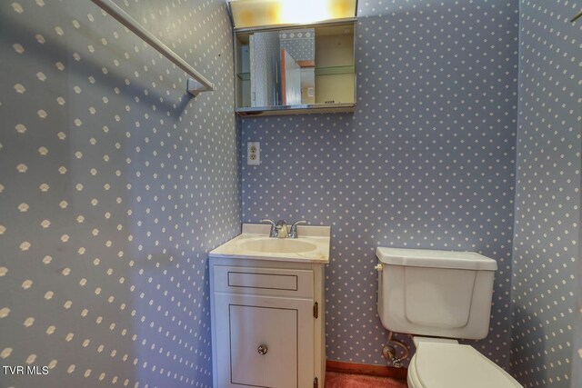 bathroom with vanity and toilet