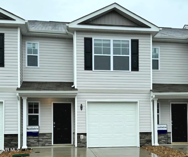 115 Raceday Center Dr Unit E-2, Bristol, TN 37620 - view of property featuring a garage, driveway, and stone siding