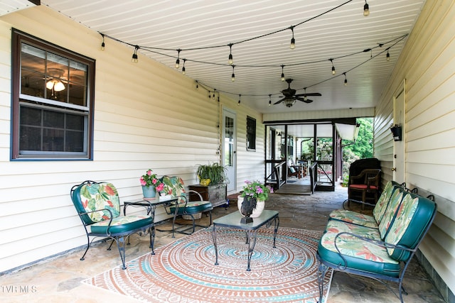 sunroom / solarium featuring ceiling fan