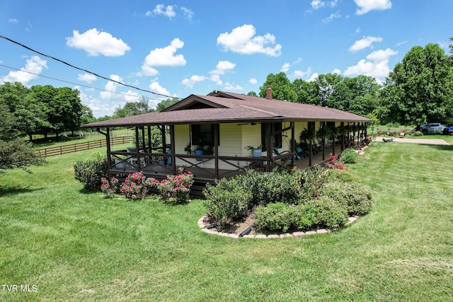 back of property with a lawn